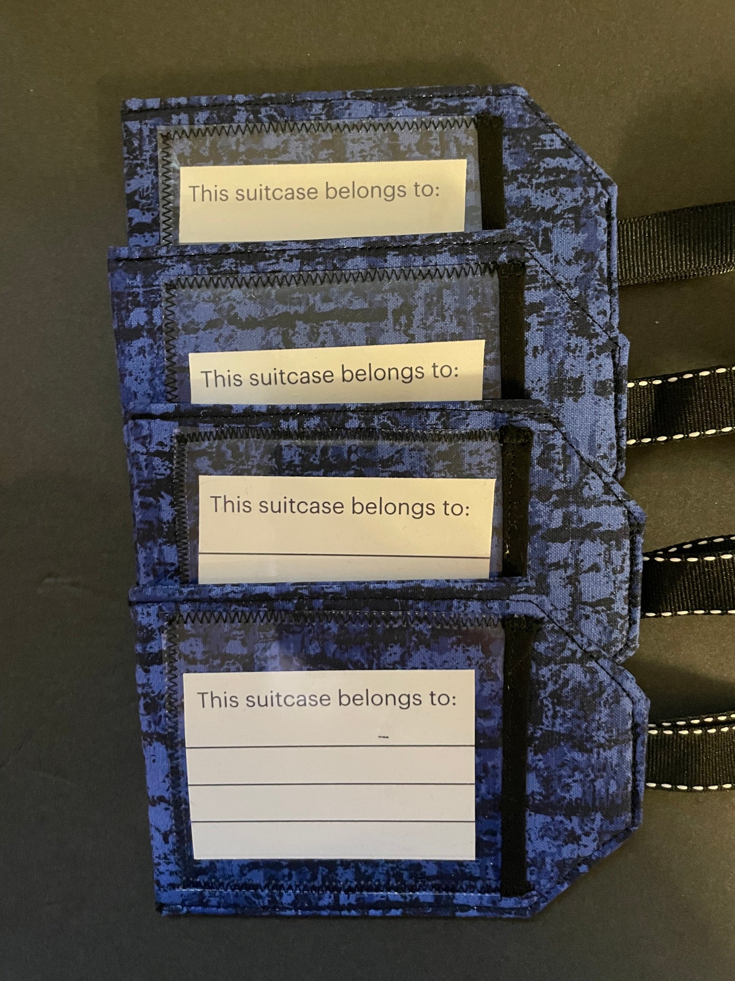 Blue and Black Luggage Tag