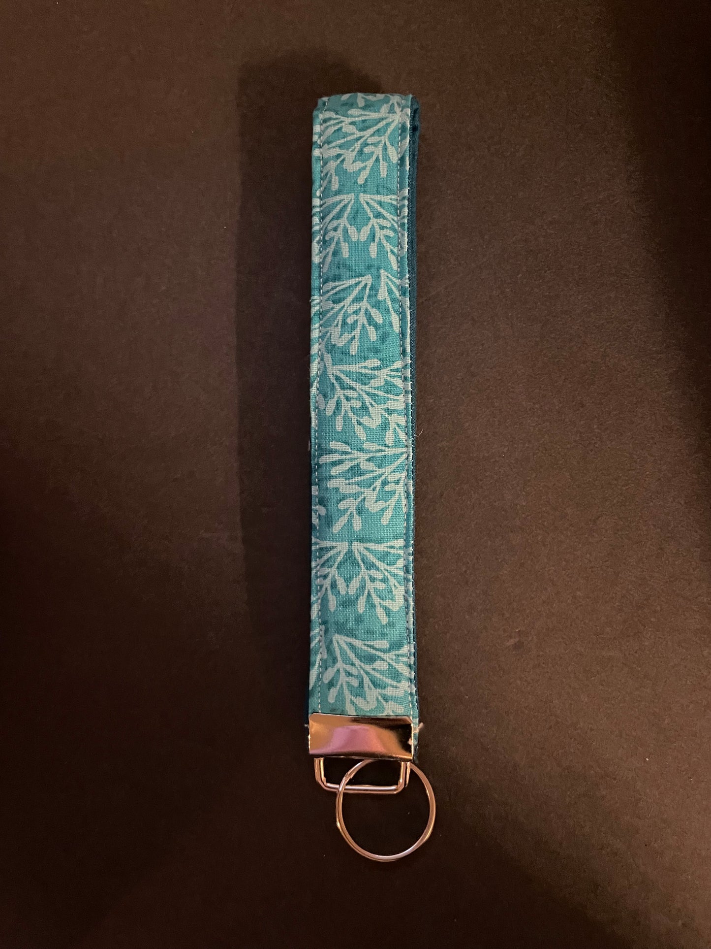 Teal Floral/leafy Wristlet
