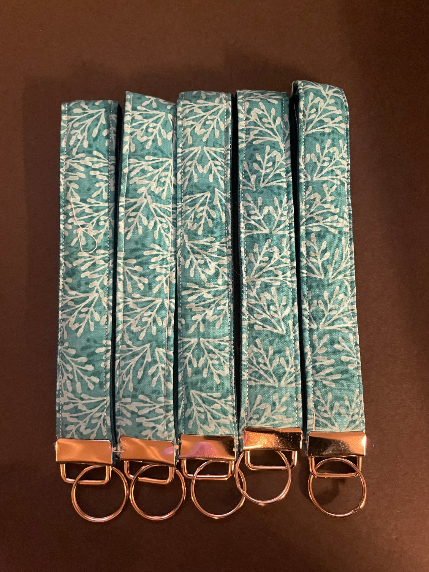 Teal Floral/leafy Wristlet
