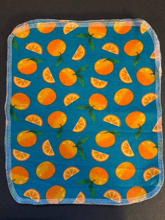 Orange Reusable Towel - Teal background